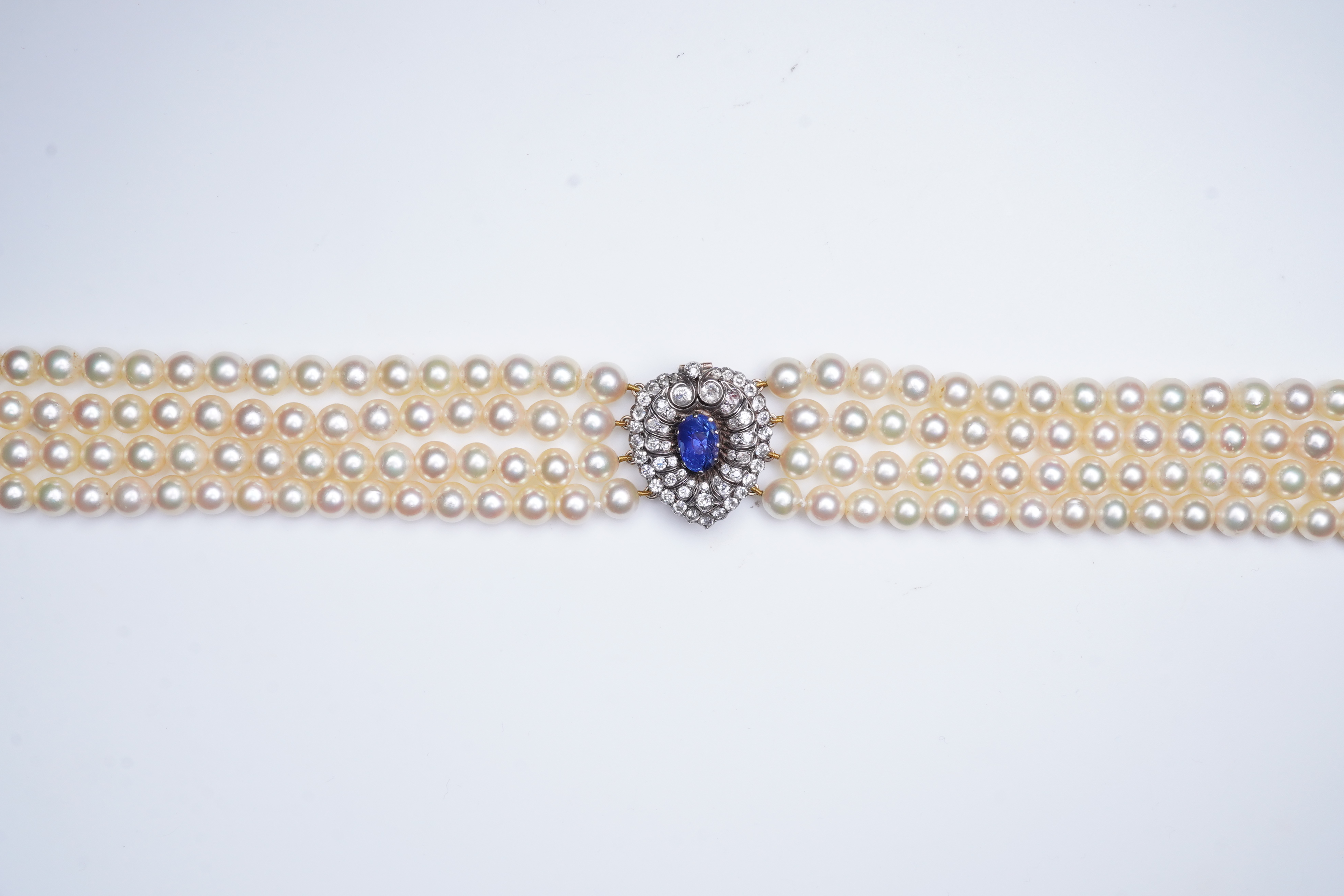 A late Victorian sapphire and diamond brooch and cultured pearl necklace, circa 1900 and later